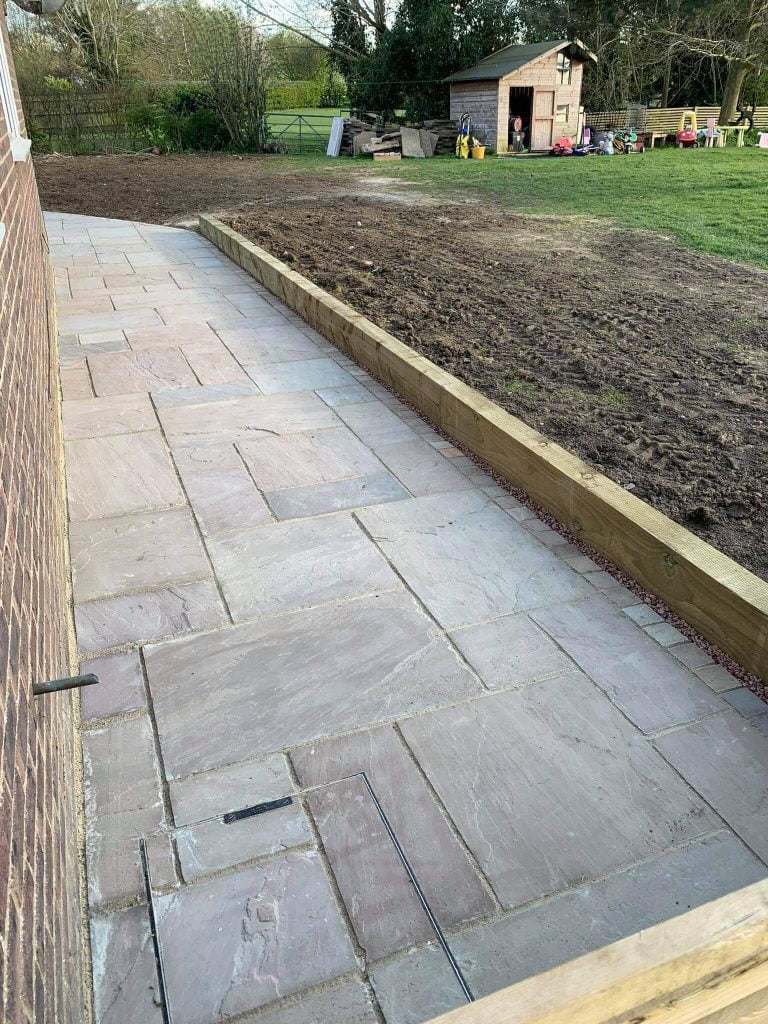 Side walkway of stone patio